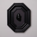 quadro con cornice ottagonale e cuore anatomico nero