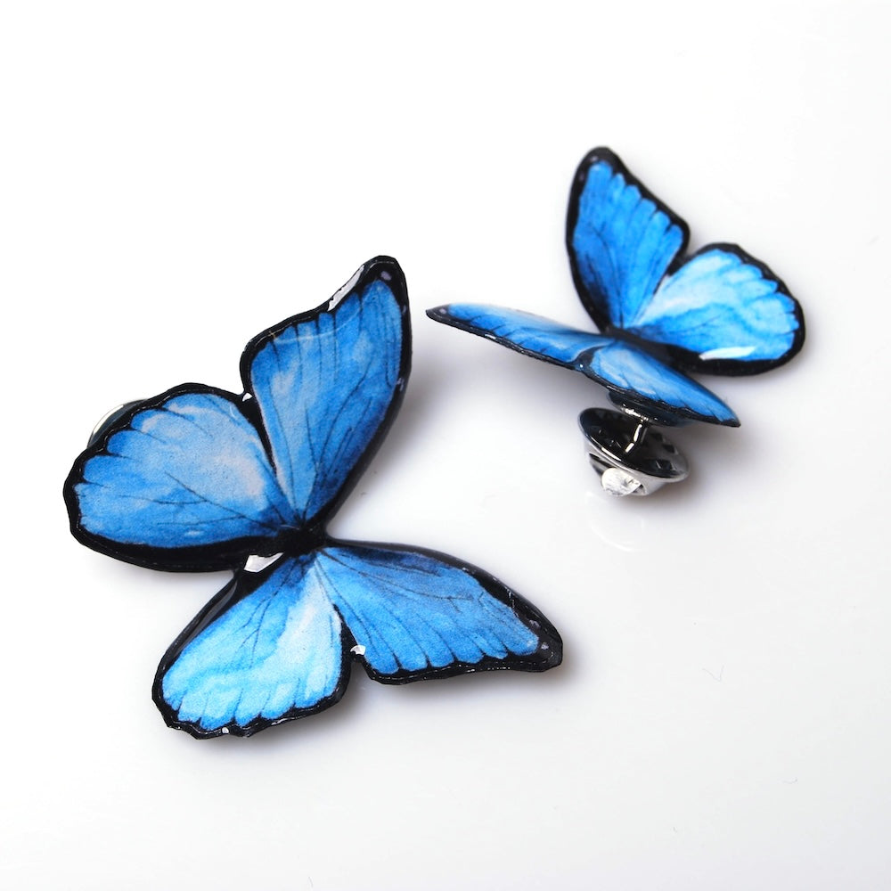 due spille farfalla blu