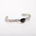 bracciale rigido intrecciato con ovale centrale con medusa marina inglobata sotto resina