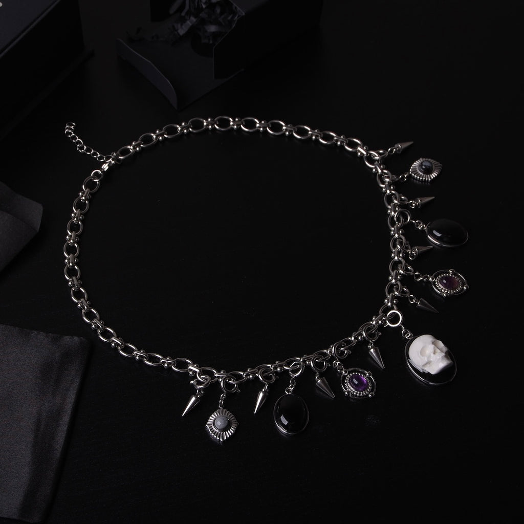 collana componibile completa con pendenti teschio, cabochon in pietre e punte in acciaio