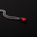 collana a sfere con pendente cuore anatomico rosso